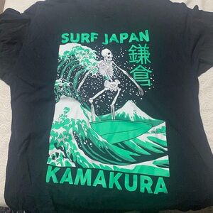 Green and black surf shirt